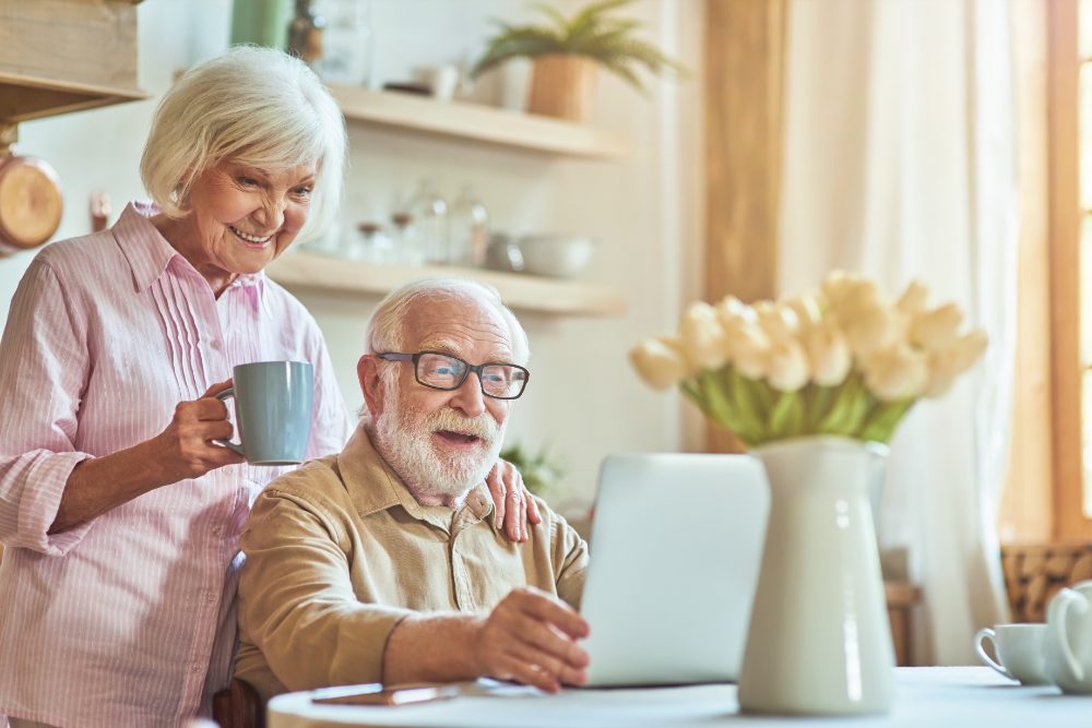 An older couple having breakfast together at home